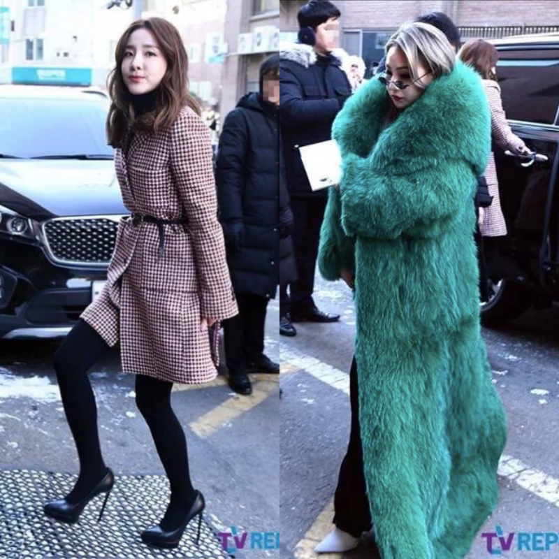 Hai thành viên Sandara Park (trái) và Chaelin của nhóm nữ 2NE1, cùng nhà SM Town với Big Bang, cũng có mặt tại đám cưới của Taeyang và Min Hyo Rin. Thời tiết lạnh tại Seoul, Hàn Quốc khiến cho hai cô nàng không thể "lơ là", phải giữ ấm tuyệt đối. Sandara Park mặc áo khoác dáng dài với họa tiết nanh sói nhỏ; Chaelin chơi trội với áo lông to sụ màu xanh ngọc. 