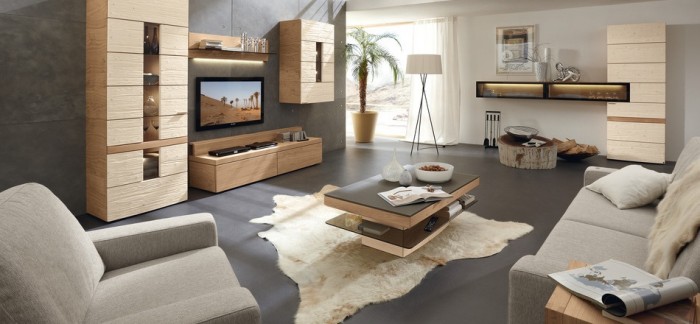 This rustic modern living room extends a welcoming appeal with earthy hues of grey, warm honey woods, and white. This design is wonderfully balanced between the opposing styles.