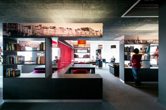 While much of the Google Docks offices are decorated in brilliant hues, this is workspace is a bit more subdued with black and white elements with touches of red.