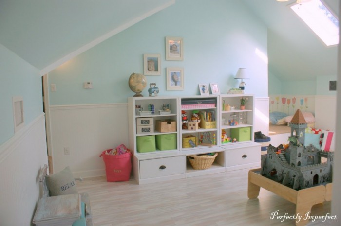 A perfectplay room.com soft attic style child's room pastels and white with storage
