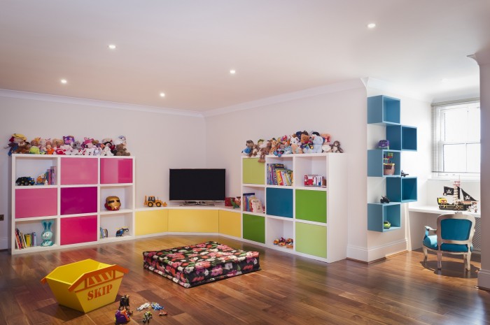 barbara-genda.com polished wood floors child's room white walls and bright color accents down-lit