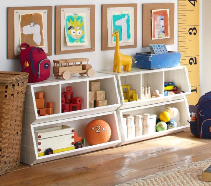 funky white storage units in child's room with featured art projects