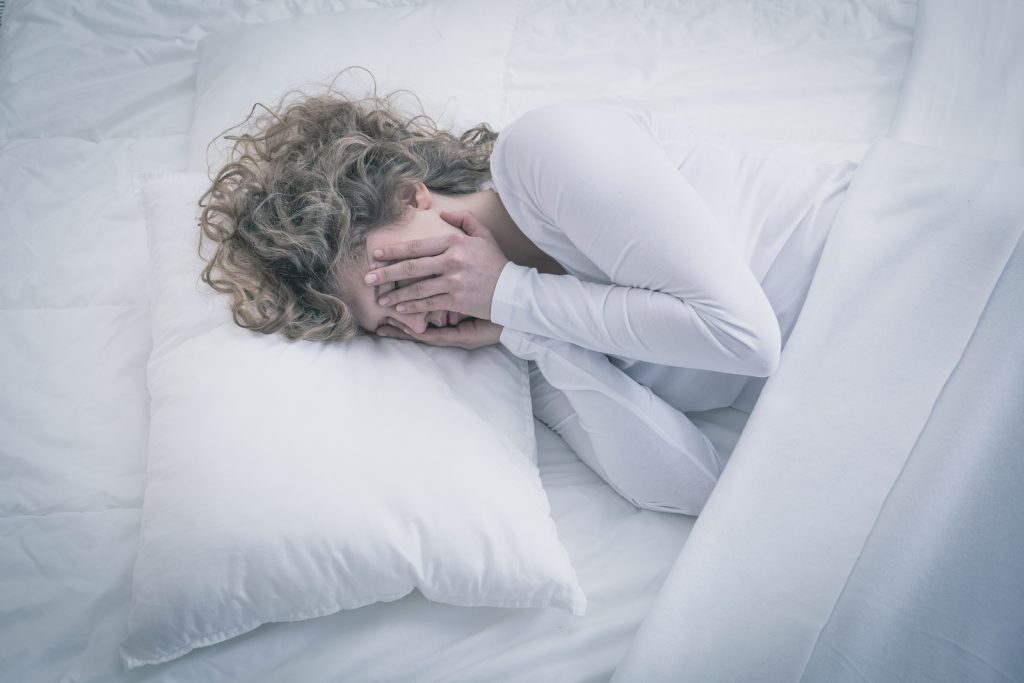 Picture of depressed woman sleeping all day