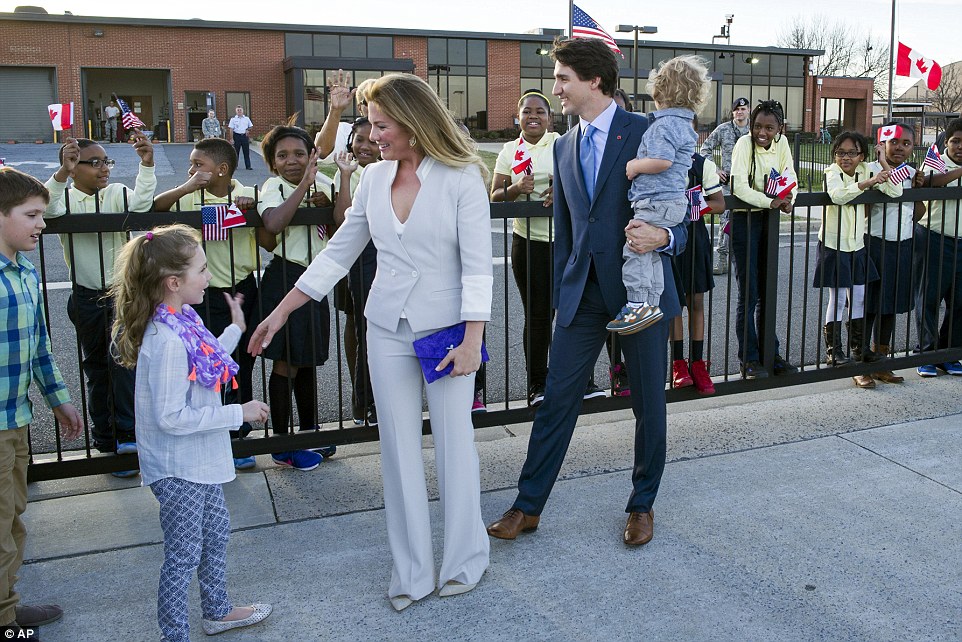 320c17a500000578-3484777-family_matters_trudeau_holds_his_youngest_son_while_sophie_walks-a-35_1457571516439