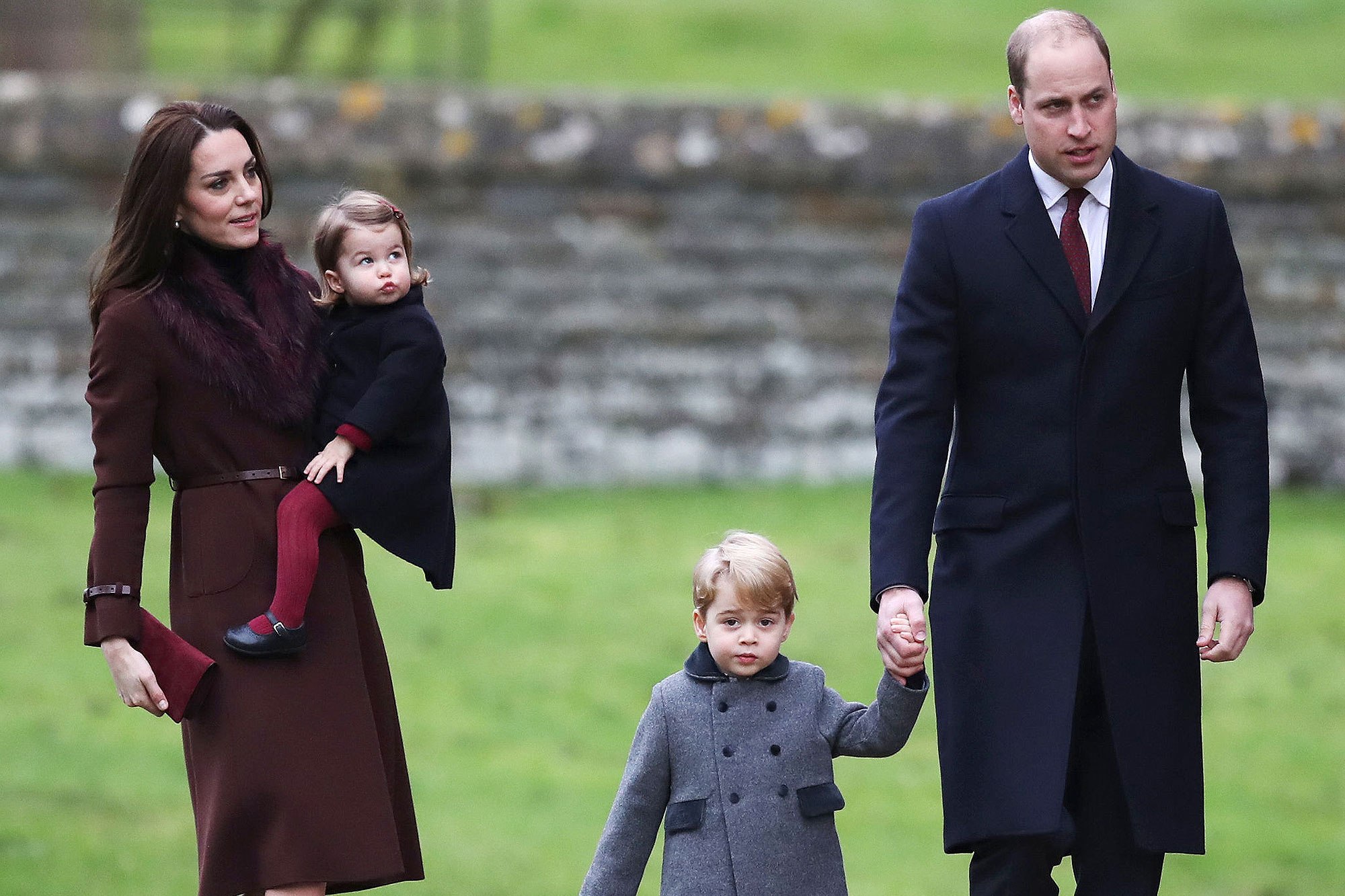 Britain's Prince William and Kate, the Duchess of Cambridge with their children Prince George and Princess Charlotte arrive to attend the morning Christmas Day service at St Mark's Church in Englefield, England, Sunday Dec. 25, 2016. A heavy cold is keeping Queen Elizabeth II from attending the traditional Christmas morning church service near her Sandringham estate in rural Norfolk, England. (Andrew Matthews/Pool via AP)