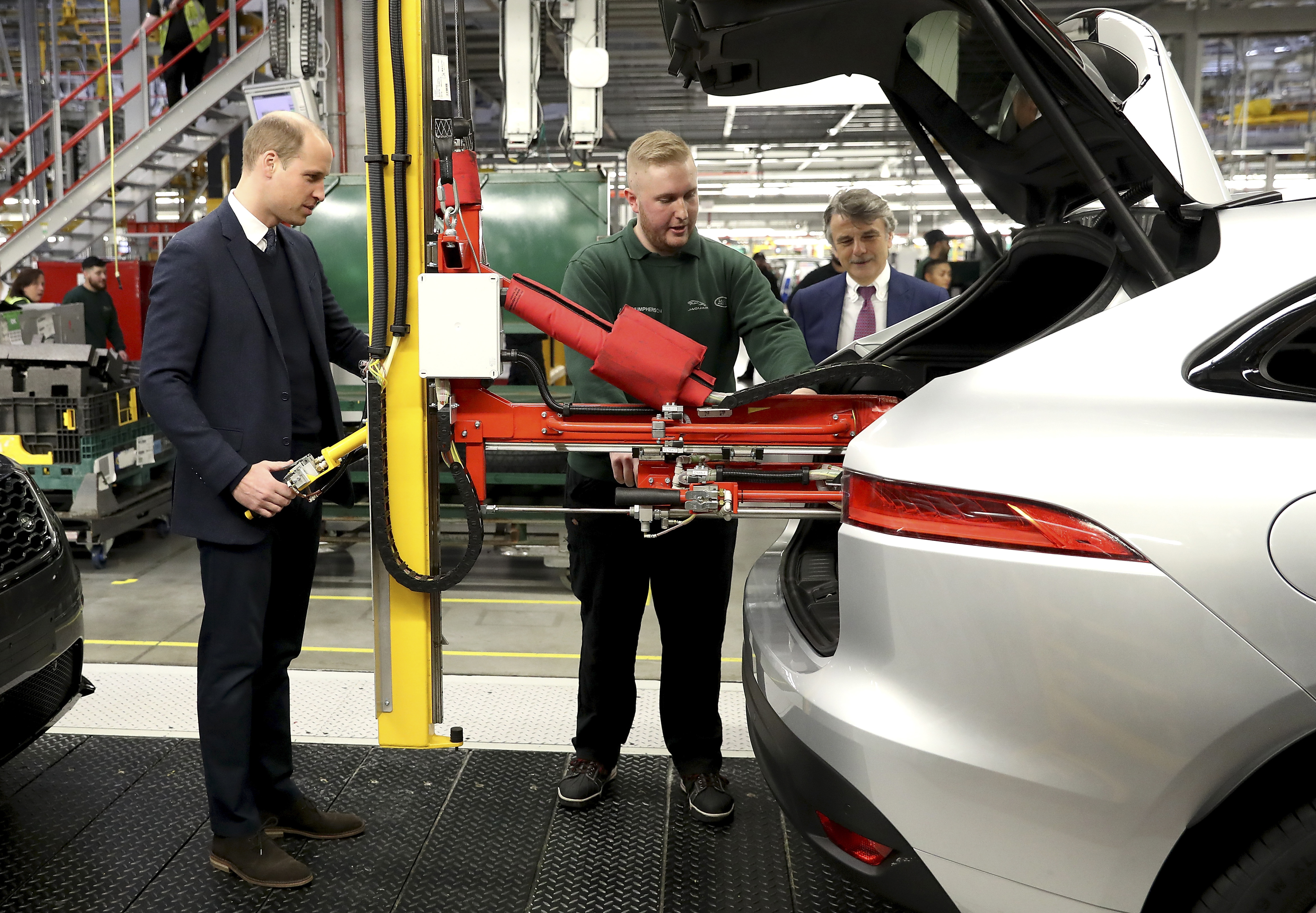 SOLIHULL, ENGLAND - NOVEMBER 22: Prince William, Duke of Cambridge learns how to fit a spare tyre during his visit with Catherine, Duchess of Cambridge to Jaguar Land Rover on November 22, 2017 in Solihull, England. (Photo by Chris Jackson/Chris Jackson/Getty Images for Jaguar Land Rover) *** Local Caption *** Prince William;Duke of Cambridge