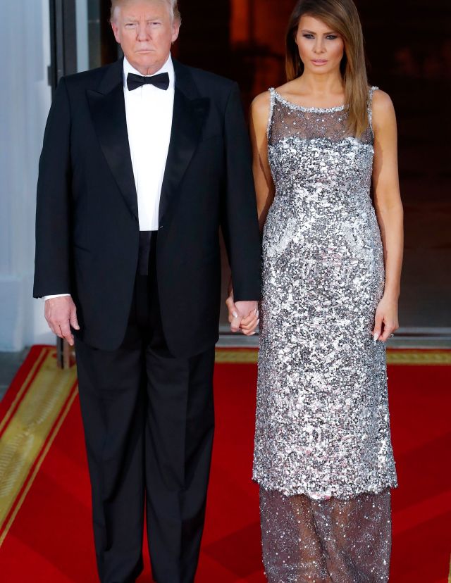 Mandatory Credit: Photo by ERIK S. LESSER/EPA-EFE/REX/Shutterstock (9641571ax) Melania Trump and Donald J. Trump French President Macron state visit to the USA, Washington - 24 Apr 2018 US President Donald J. Trump (L) and First Lady Melania Trump (R) await the arrival French President Emmanuel Macron and his wife Brigitte Macron at the North Portico before a state dinner in the Macrons honor at the White House in Washington, DC, USA, 24 April 2018. President Macron will be in DC for three days for a state visit at the White House and an address to a joint session of Congress on 25 April.