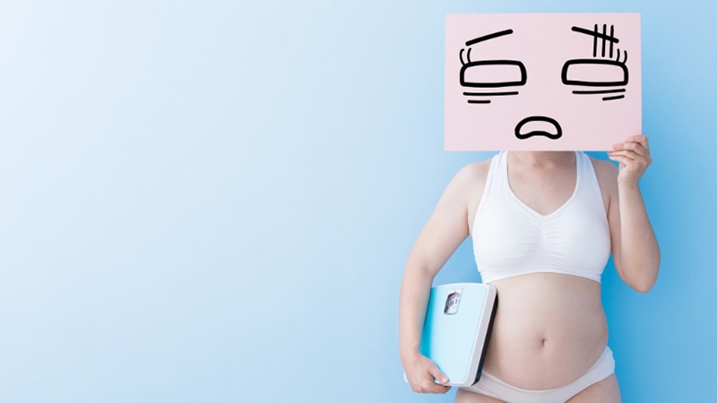Fat overweight woman take tired billboard and Body weight with blue background, asian