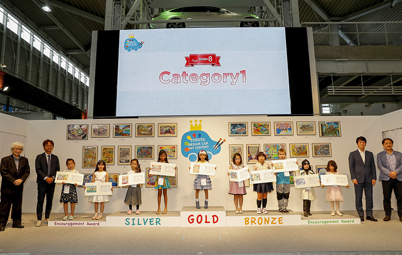 TOKYO, JAPAN - AUGUST 29: Winners and juries of age 7 and under category line up for photos during the 12th Toyota Dream Car Art Contest Award Ceremony on August 29, 2018 in Tokyo, Japan. (Photo by Ken Ishii/Getty Images for TOYOTA MOTOR CORPORATION)