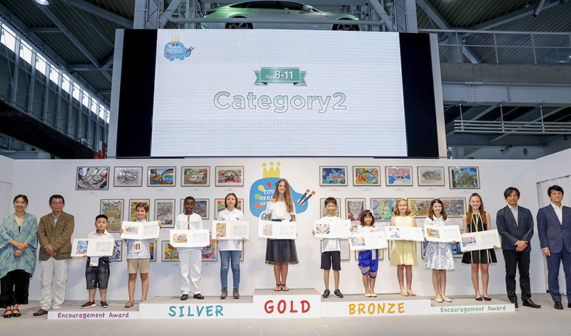 TOKYO, JAPAN - AUGUST 29: Winners and juries of ages 8 to 11 category line up for photos during the 12th Toyota Dream Car Art Contest Award Ceremony on August 29, 2018 in Tokyo, Japan. (Photo by Ken Ishii/Getty Images for TOYOTA MOTOR CORPORATION)